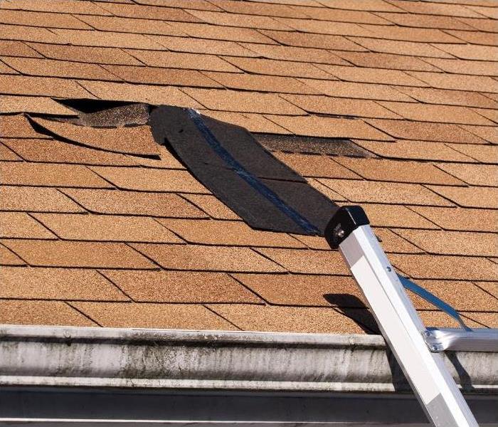 Windstorm damage to a Sandy Springs residential roof