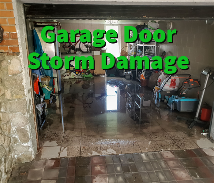 Flooding inside a garage door caused by a storm.